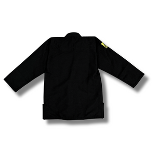 Black Adamantium BJJ Gi – back view, showcasing a clean and minimalist design with a yellow patch on the left sleeve.
